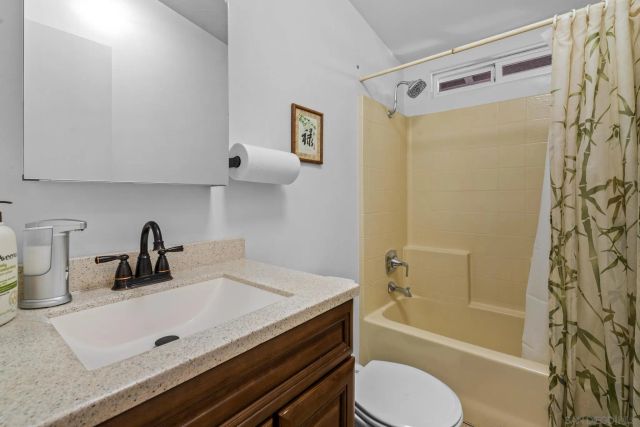 a view of a pathway that has a flower plants