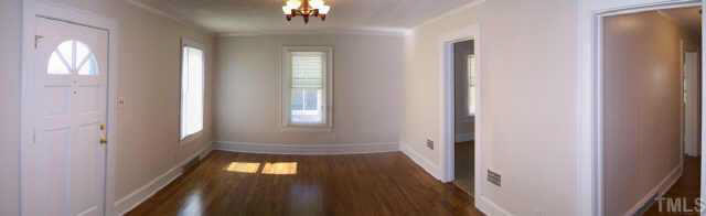 224 Rolling Road Burlington, NC 27217 - Photo 4 of 10 In the living room the beautiful oak floors are original to the home.