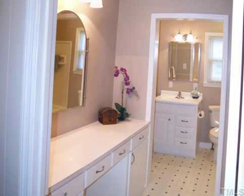 224 Rolling Road Burlington, NC 27217 - Photo 5 of 10 The downstairs full bath has new vanities and fixtures.