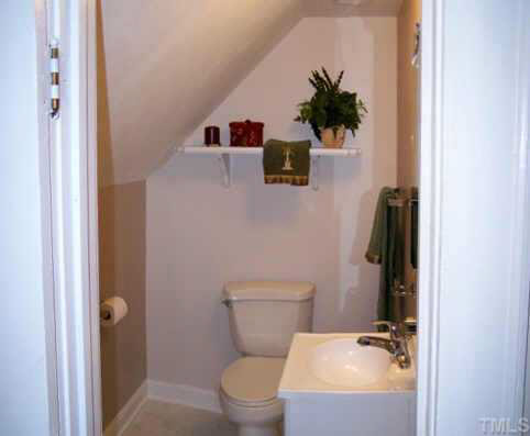 224 Rolling Road Burlington, NC 27217 - Photo 6 of 10 Located upstairs, the half bath features a new vanity and fixtures.