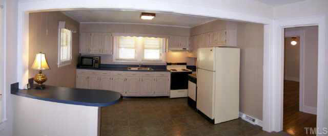 224 Rolling Road Burlington, NC 27217 - Photo 7 of 10 The eat-in kitchen has lots of cabinetry.