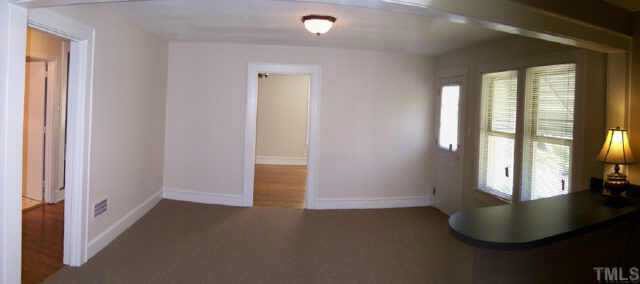 224 Rolling Road Burlington, NC 27217 - Photo 9 of 10 Adjacent to the kitchen, this room has been used for dining, or could be a family room.
