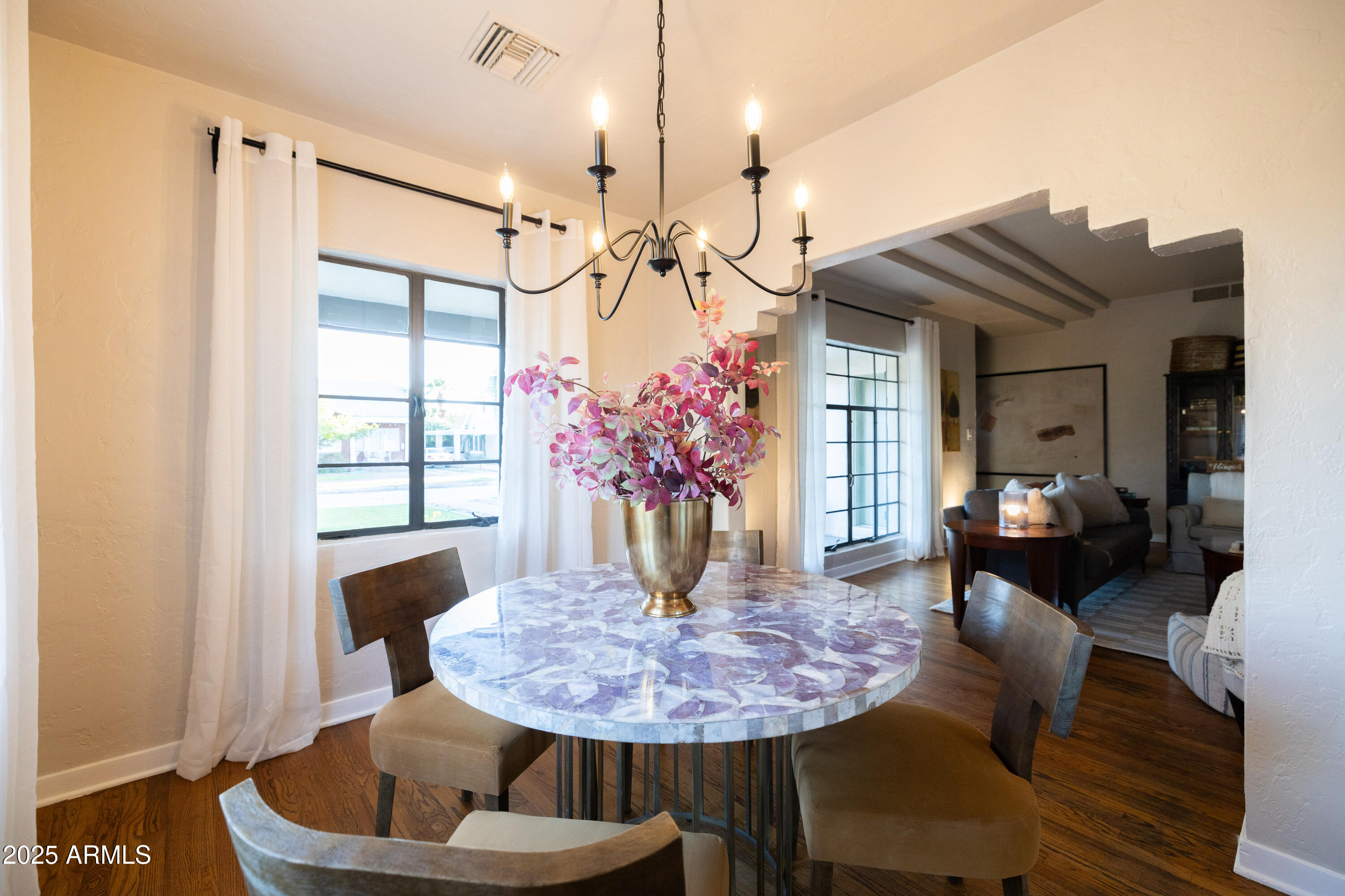 126 West Coronado Road Phoenix, AZ 85003 - Photo 18 of 60 a view of a dining room with furniture and wooden floor