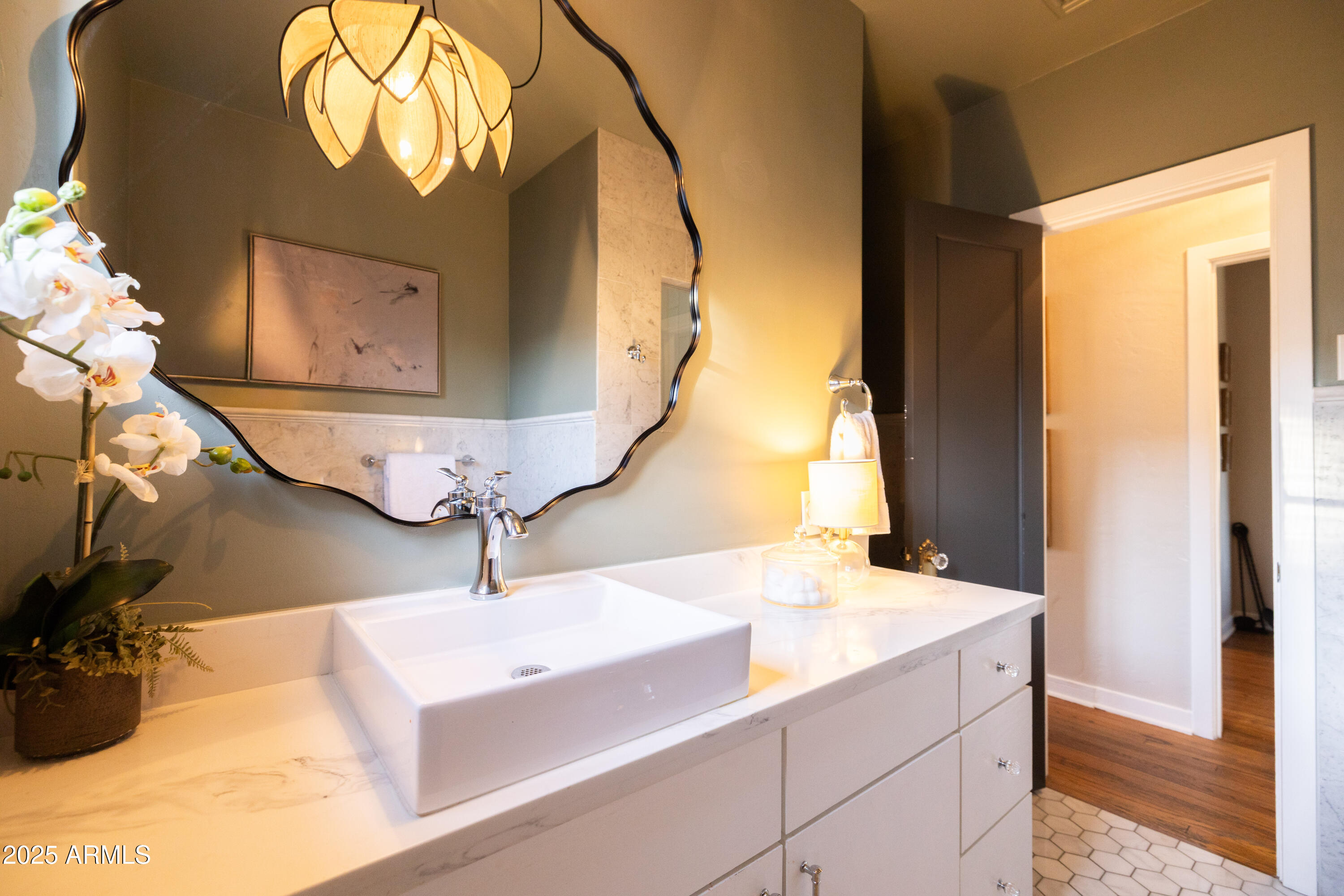 126 West Coronado Road Phoenix, AZ 85003 - Photo 33 of 60 a bathroom with a sink a mirror and a vanity