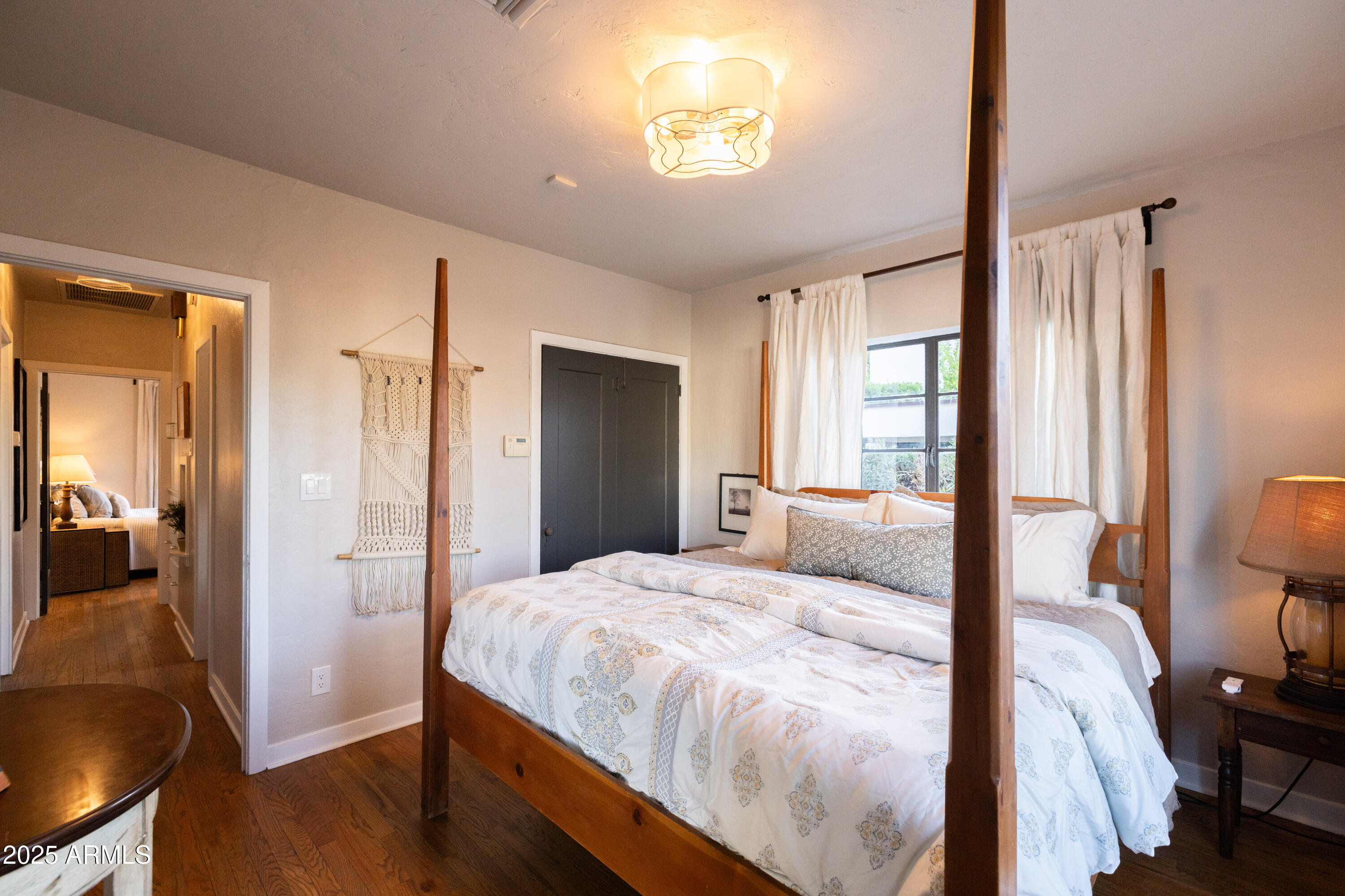 126 West Coronado Road Phoenix, AZ 85003 - Photo 39 of 60 a bedroom with a bed and wooden floor