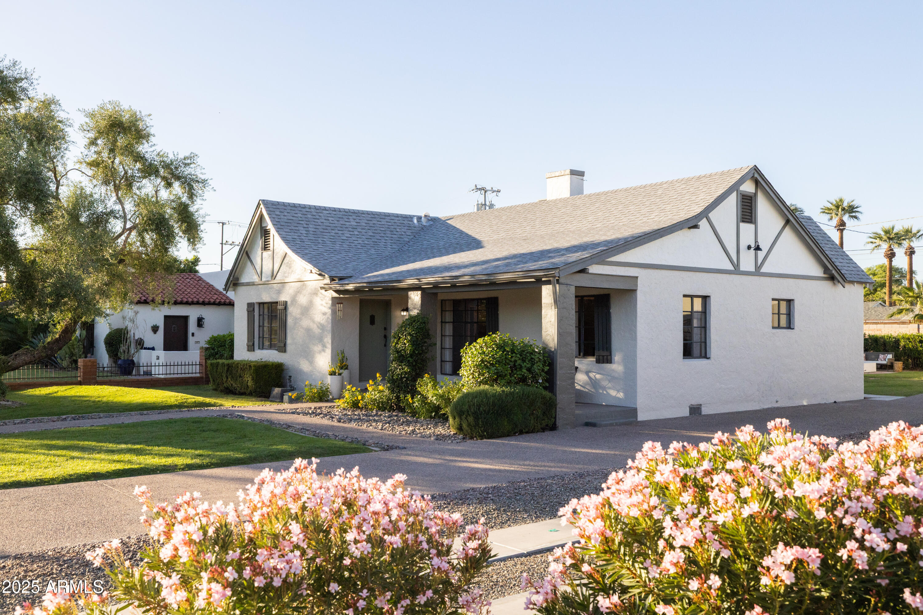 126 West Coronado Road Phoenix, AZ 85003 - Photo 5 of 60 a front view of a house with a yard and trees