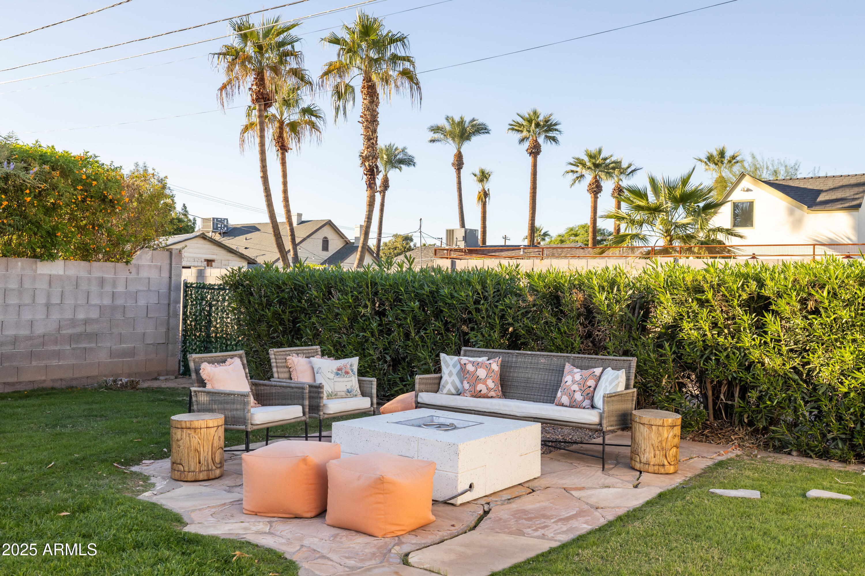 126 West Coronado Road Phoenix, AZ 85003 - Photo 53 of 60 a view of a patio with couches table and chairs potted plants and palm tree