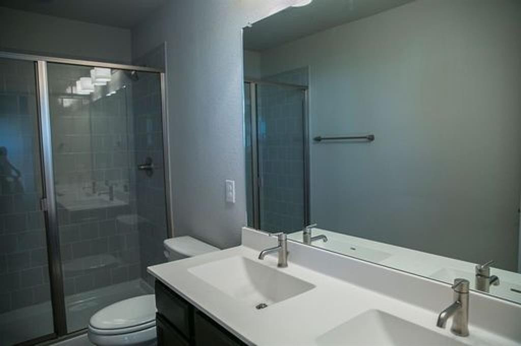 117 Calm Water Loop Bastrop, TX 78602 - Photo 6 of 7 a bathroom with a sink toilet and shower