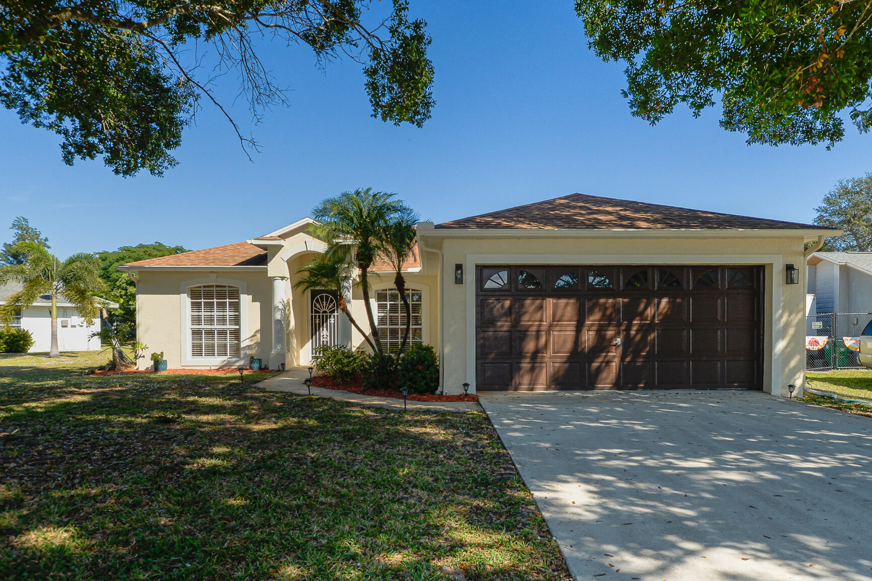 a front view of a house with a yard