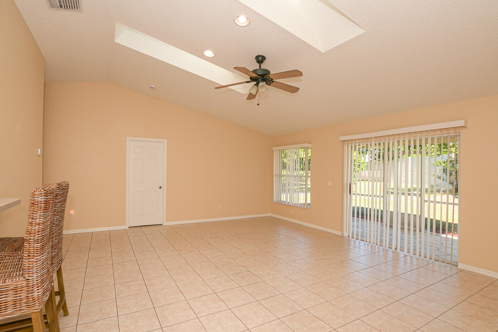 2201 Southeast Carnation Road Port St. Lucie, FL 34952 - Photo 15 of 37 a view of a livingroom with a ceiling fan and window