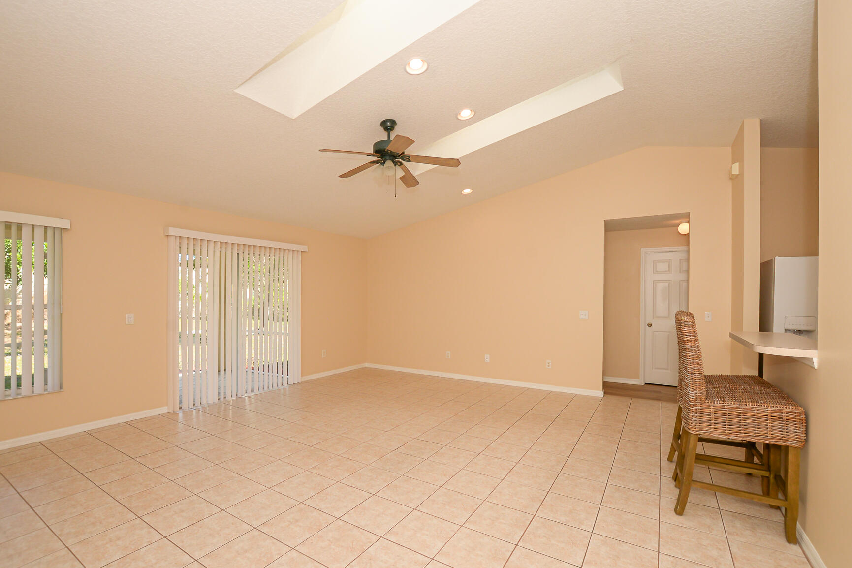 2201 Southeast Carnation Road Port St. Lucie, FL 34952 - Photo 16 of 37 wooden floor in an empty room with a window