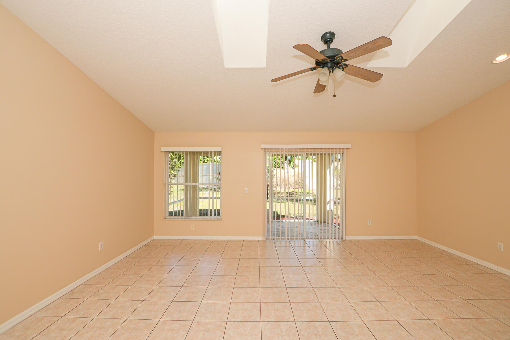 2201 Southeast Carnation Road Port St. Lucie, FL 34952 - Photo 17 of 37 a view of an empty room with a window