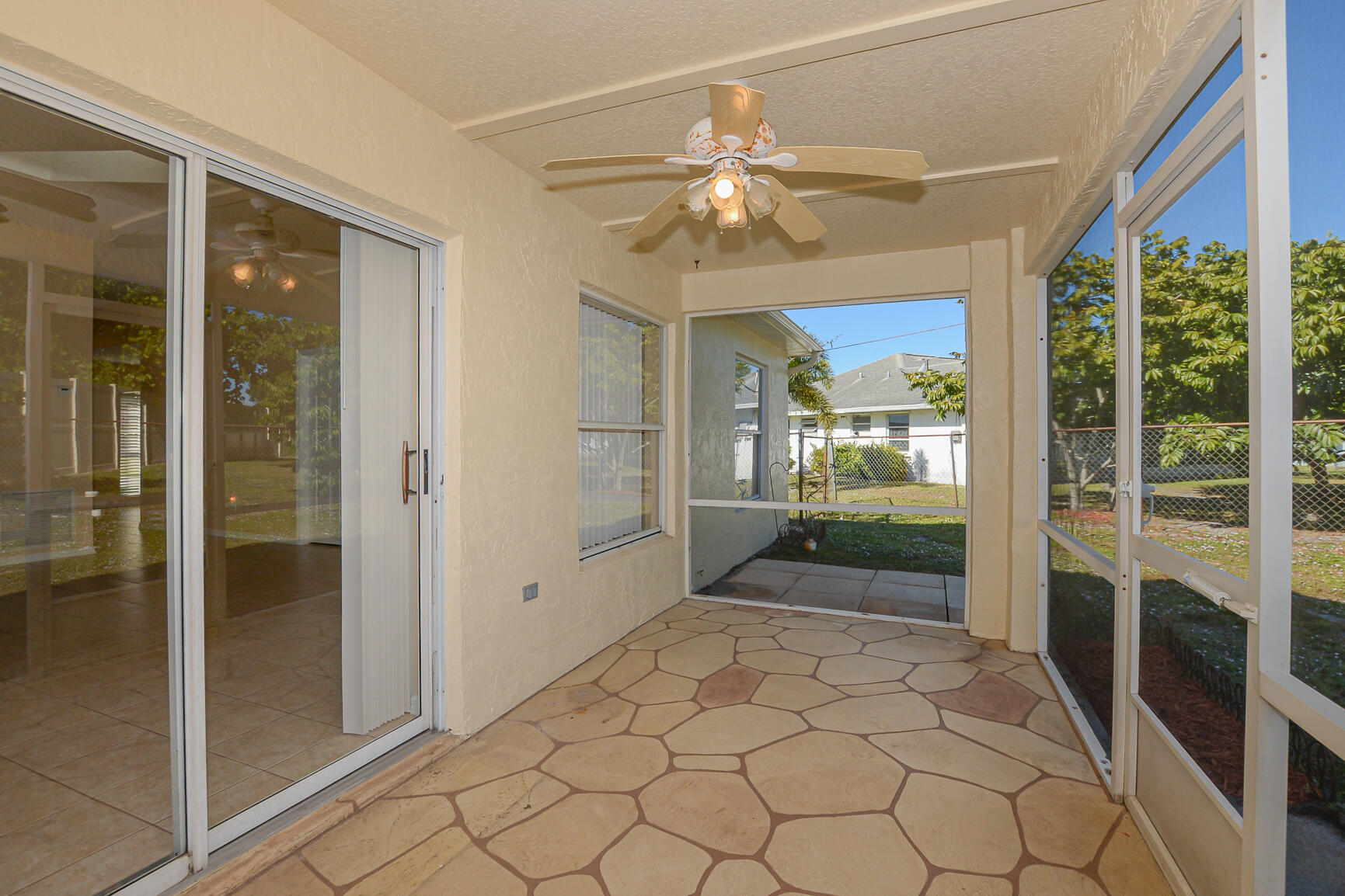 2201 Southeast Carnation Road Port St. Lucie, FL 34952 - Photo 30 of 37 a view of a hallway with wooden floor and windows