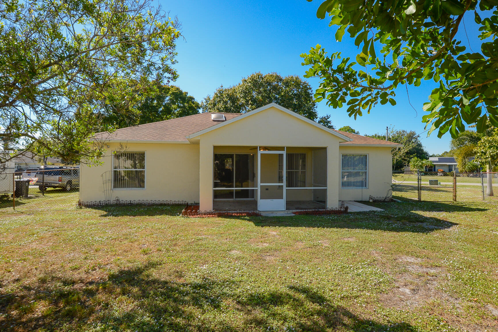 2201 Southeast Carnation Road Port St. Lucie, FL 34952 - Photo 33 of 37 a view of a house with a yard
