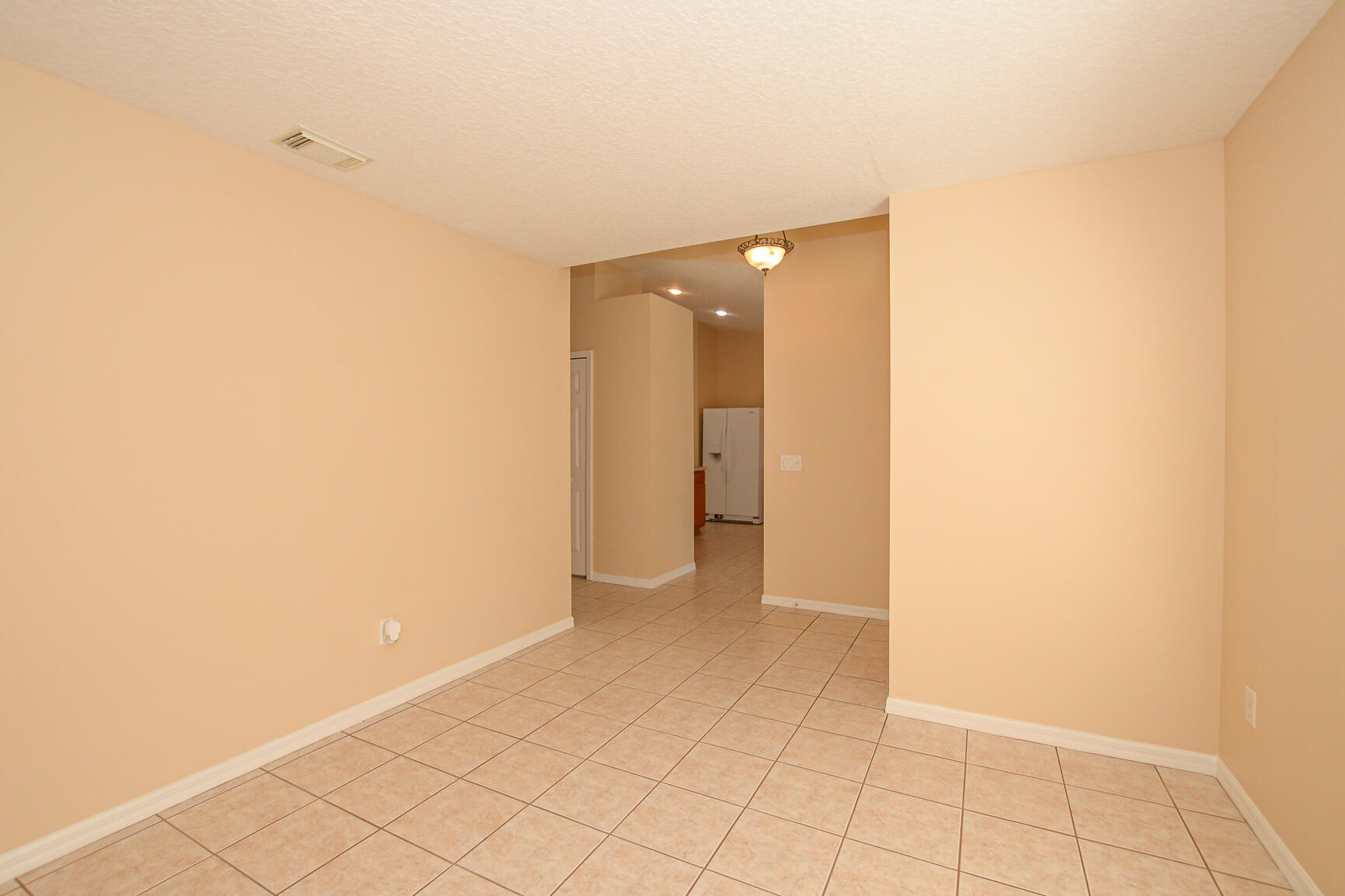 2201 Southeast Carnation Road Port St. Lucie, FL 34952 - Photo 9 of 37 a view of an empty room