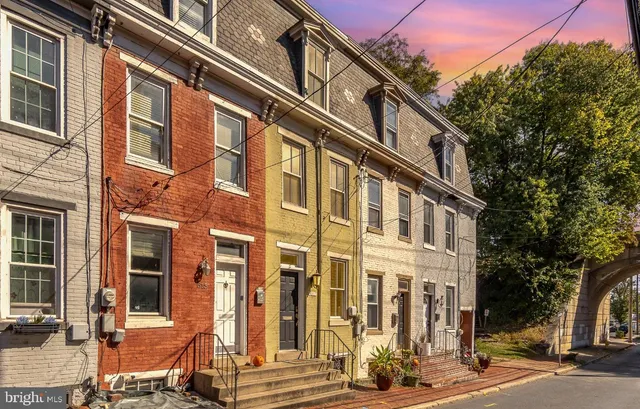 a front view of a building with a street