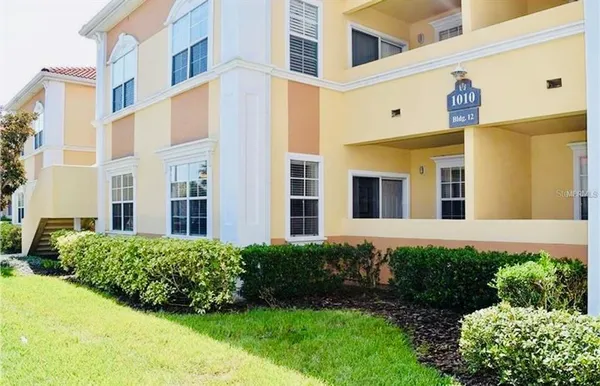 a view of a building next to a yard