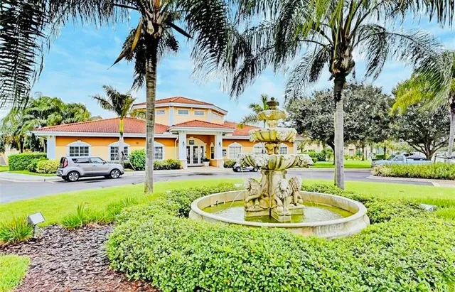a view of a house with swimming pool and a chairs