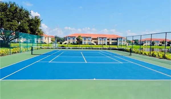 a view of an outdoor space and basketball court