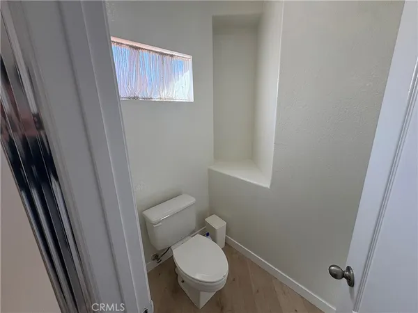 a bathroom with a toilet and a sink