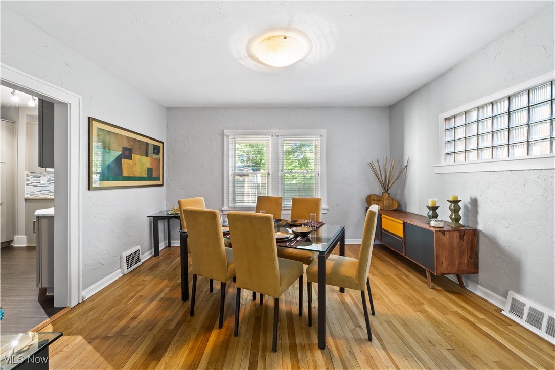 13629 Cedar Road Cleveland, OH 44118 - Photo 3 of 12 Dining space with a textured wall and hardwood / wood-style floors