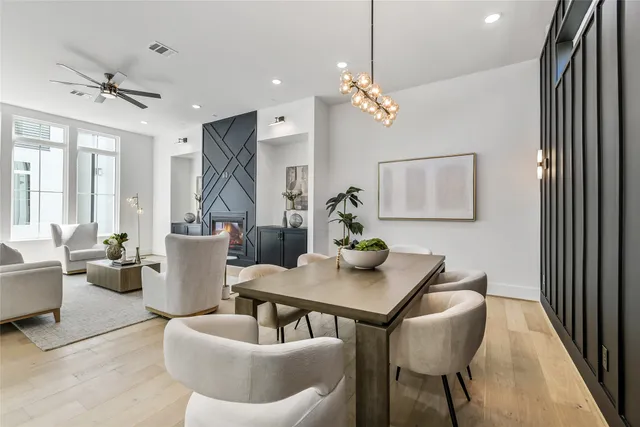 a kitchen with kitchen island a large counter top space a sink stainless steel appliances and cabinets
