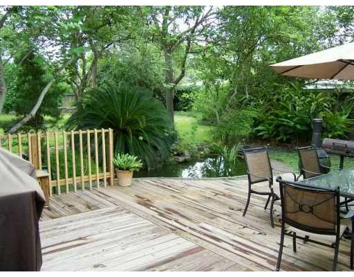 a view of a chairs with a backyard