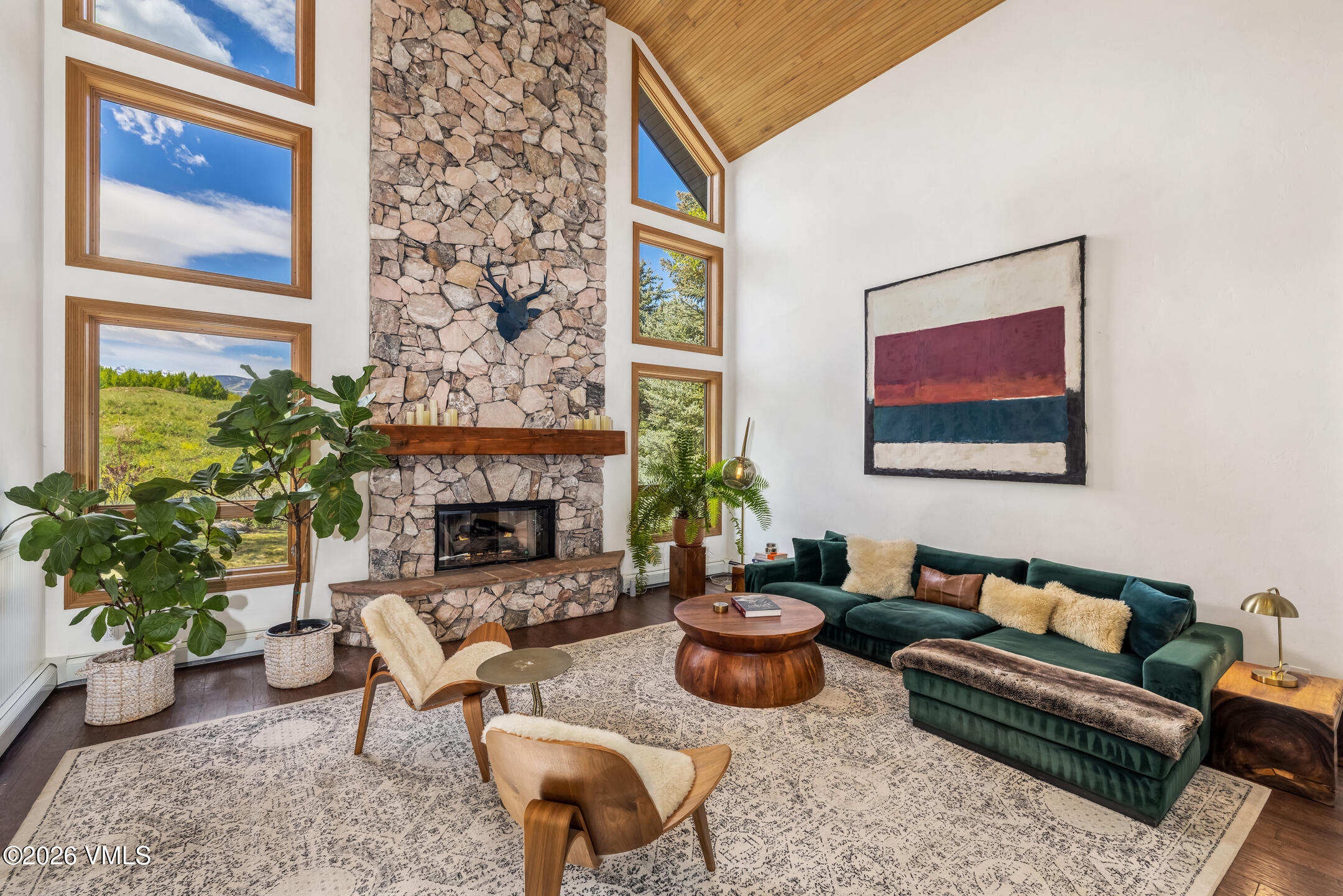 321 Meile Lane Edwards, CO 81632 - Photo 4 of 44 a living room with furniture a fireplace and a potted plant