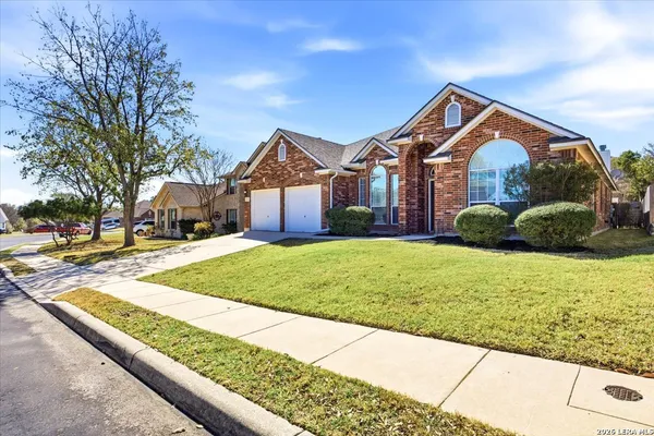 a front view of house with yard and green space