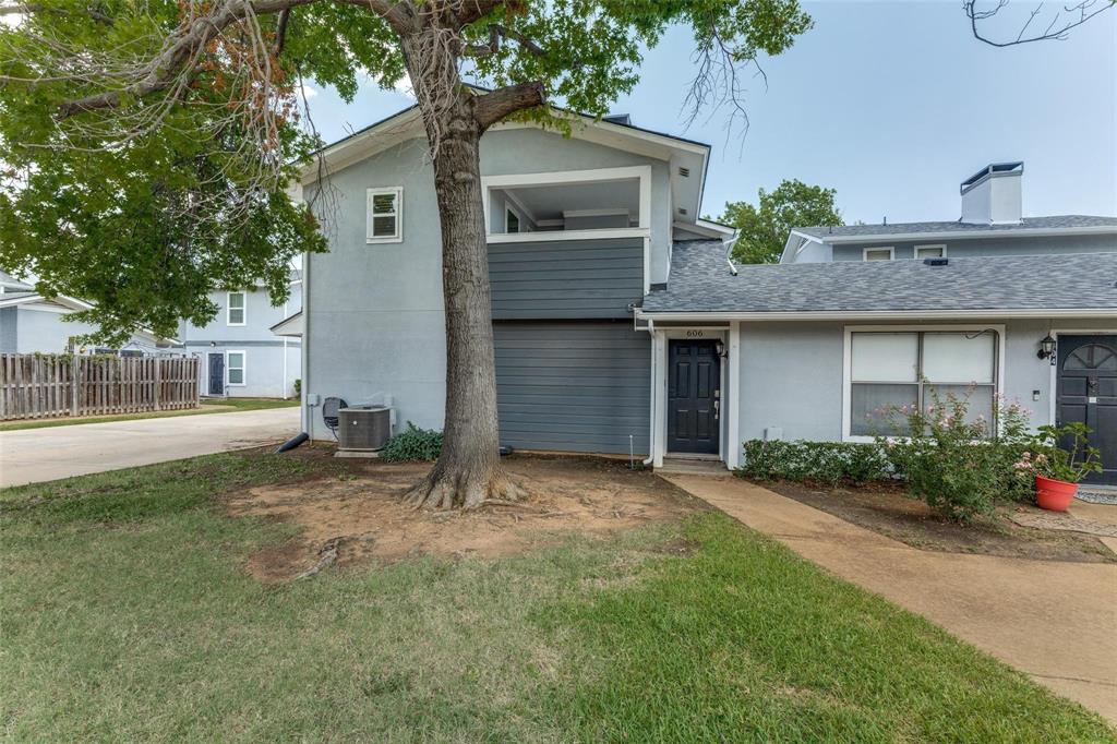 606 Ridgeline Drive Hurst, TX 76053 - Photo 19 of 29 a front view of a house with a yard and garage