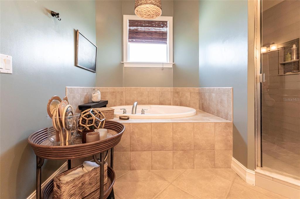 3712 Balboa Court Punta Gorda, FL 33983 - Photo 13 of 53 a bathroom with a sink a bathtub and shower