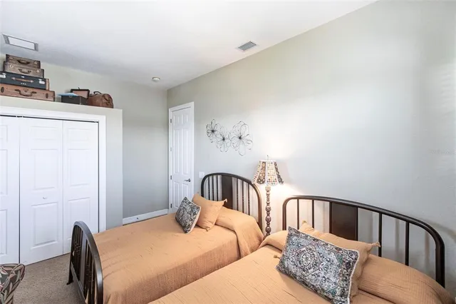 a bedroom with furniture and wooden floor