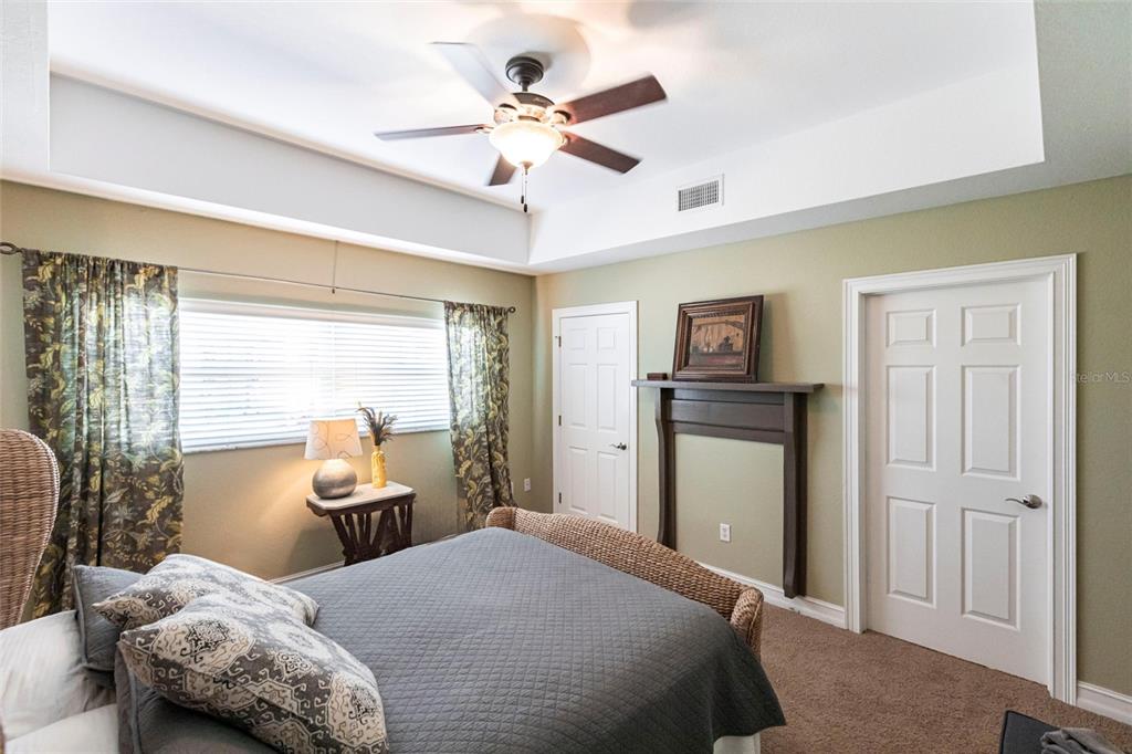 3712 Balboa Court Punta Gorda, FL 33983 - Photo 31 of 53 a bedroom with a bed and a chandelier