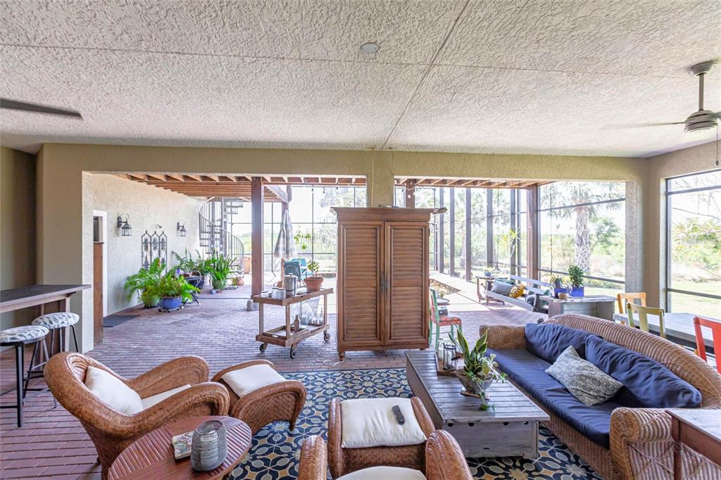3712 Balboa Court Punta Gorda, FL 33983 - Photo 34 of 53 a living room with furniture and a large window