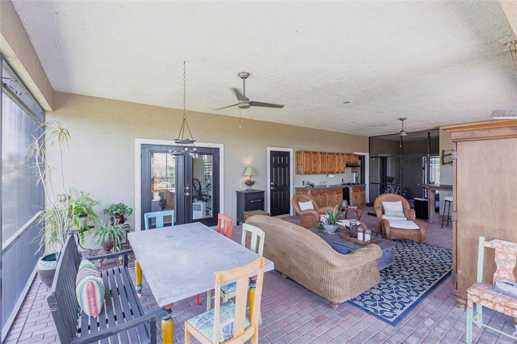 3712 Balboa Court Punta Gorda, FL 33983 - Photo 35 of 53 a living room with furniture a dining table and a fireplace