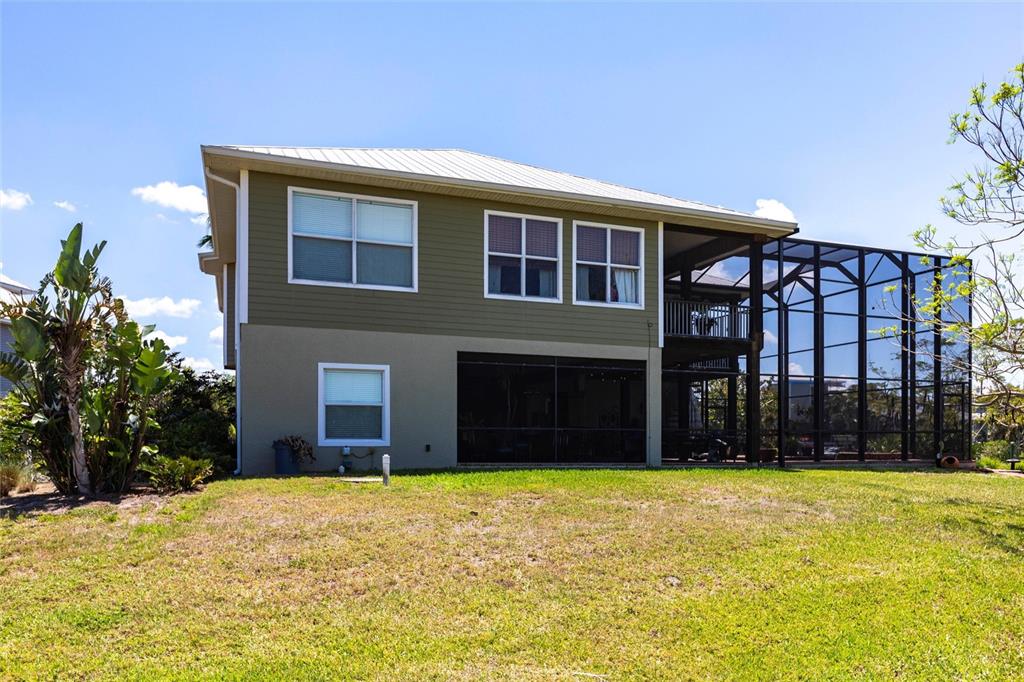 3712 Balboa Court Punta Gorda, FL 33983 - Photo 41 of 53 a view of a house with a yard