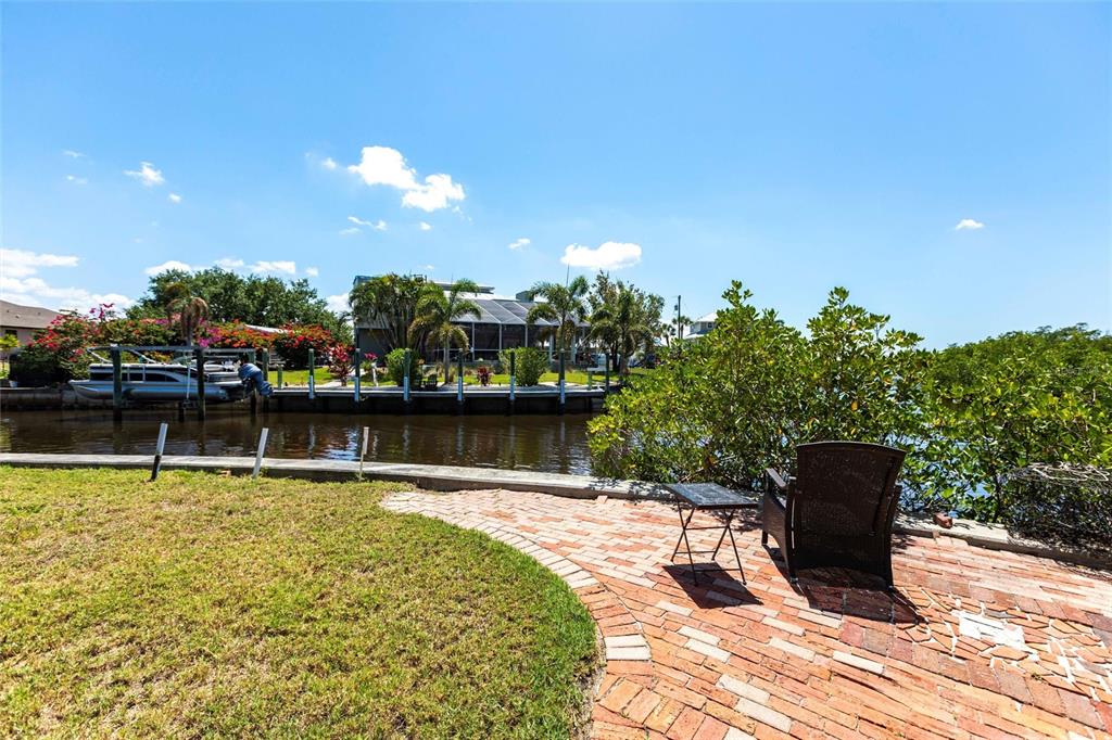 3712 Balboa Court Punta Gorda, FL 33983 - Photo 45 of 53 a swimming pool with chairs