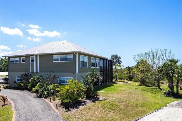 an aerial view of a houses with outdoor space