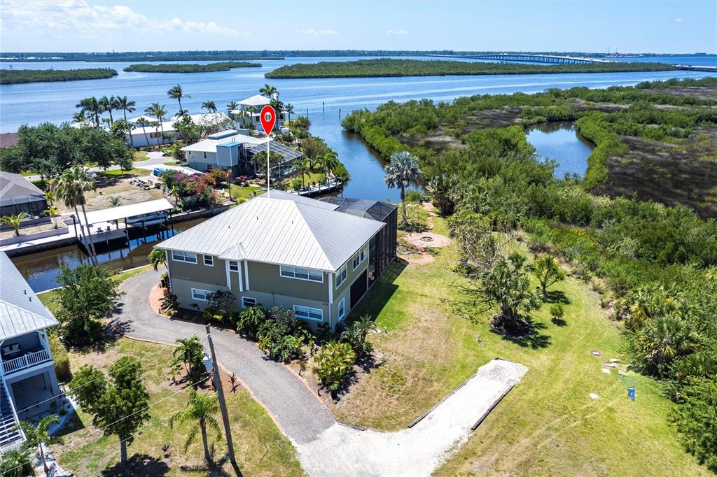 3712 Balboa Court Punta Gorda, FL 33983 - Photo 48 of 53 a aerial view of a house with a yard and potted plants
