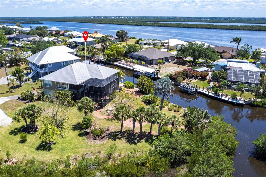 3712 Balboa Court Punta Gorda, FL 33983 - Photo 49 of 53 a view of a house with a yard and a garden