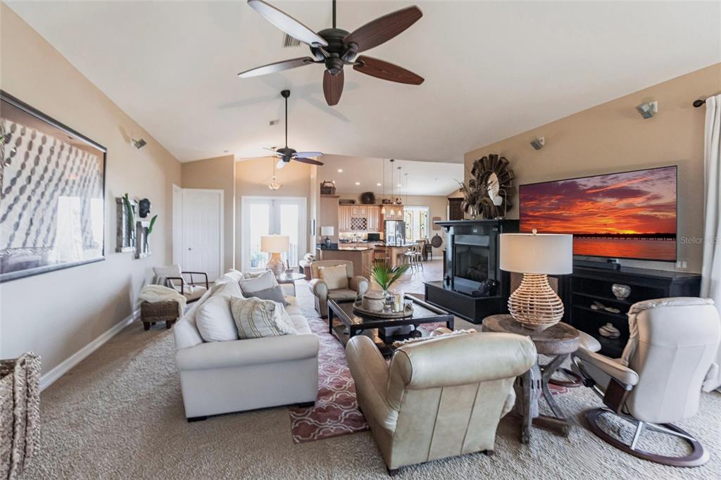 3712 Balboa Court Punta Gorda, FL 33983 - Photo 6 of 53 a living room with furniture a ceiling fan and a window