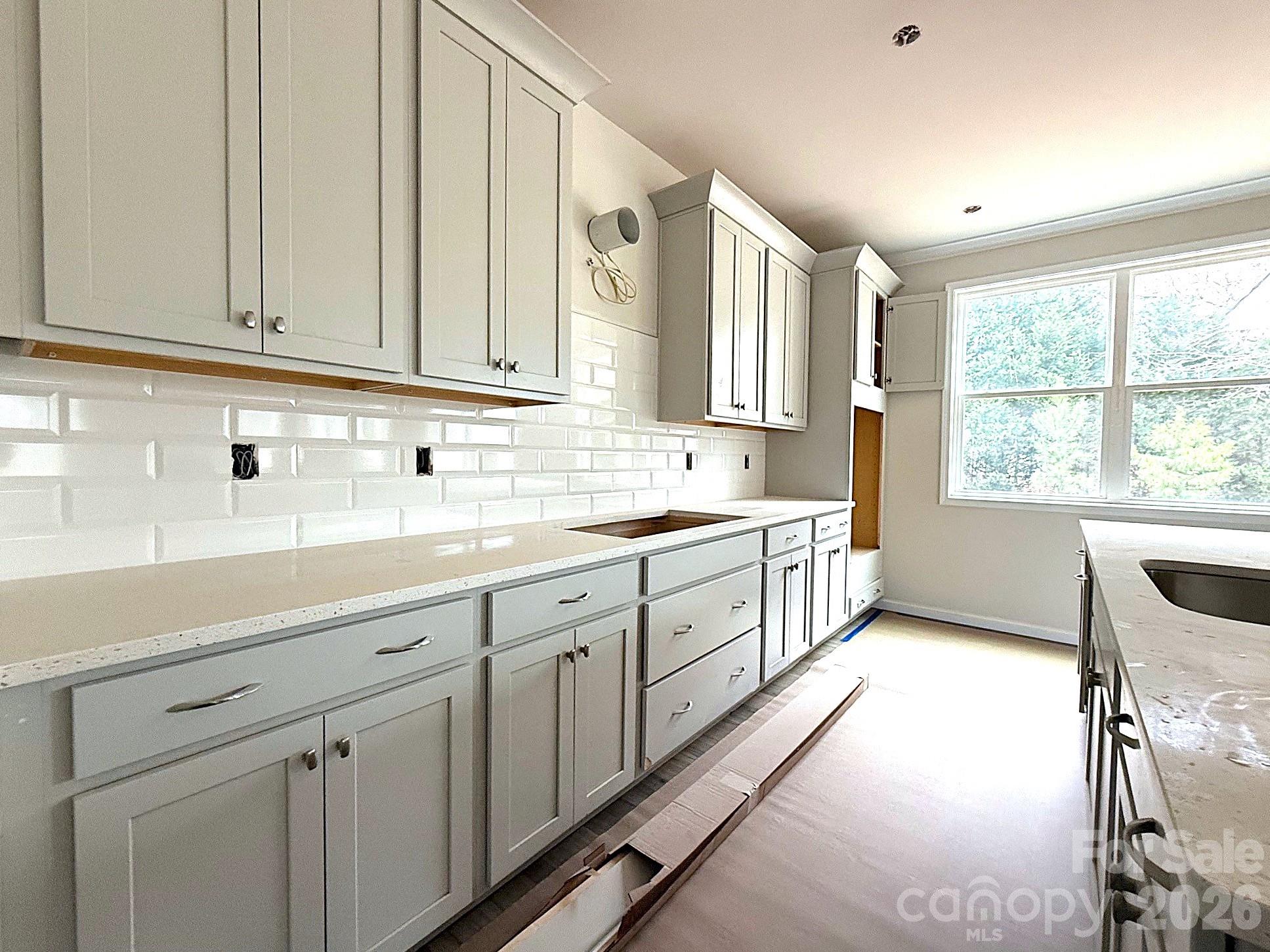 9969 Cask Way Huntersville, NC 28078 - Photo 15 of 36 a kitchen with sink cabinets and window