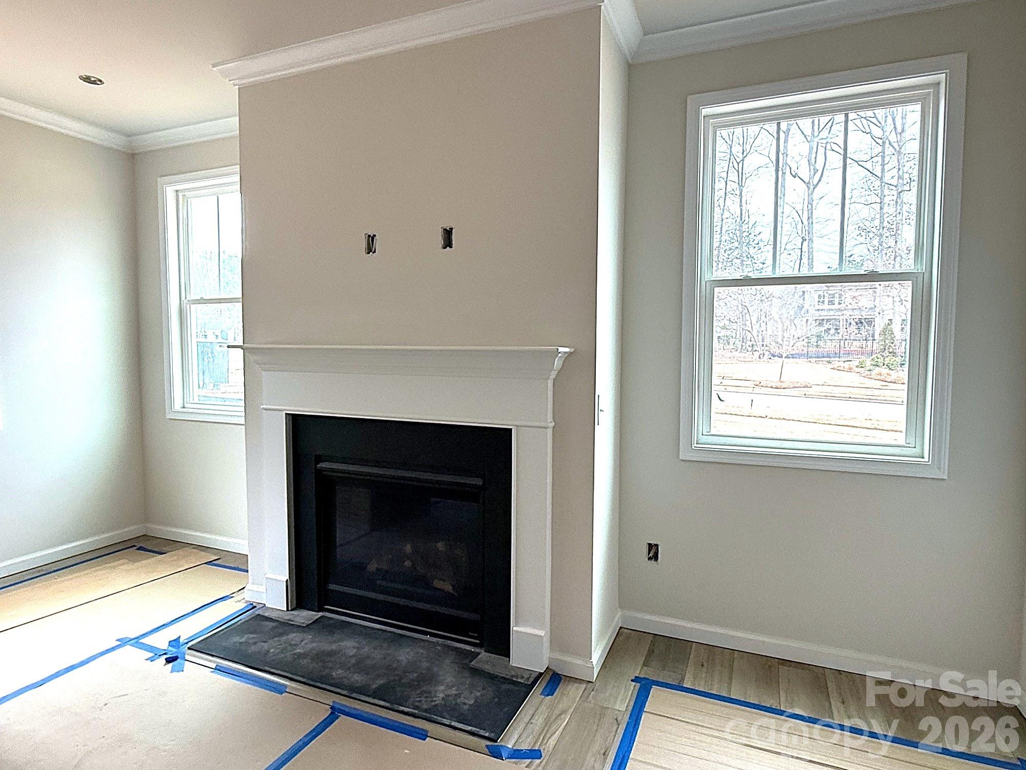 9969 Cask Way Huntersville, NC 28078 - Photo 9 of 36 a living room with a fireplace and a window