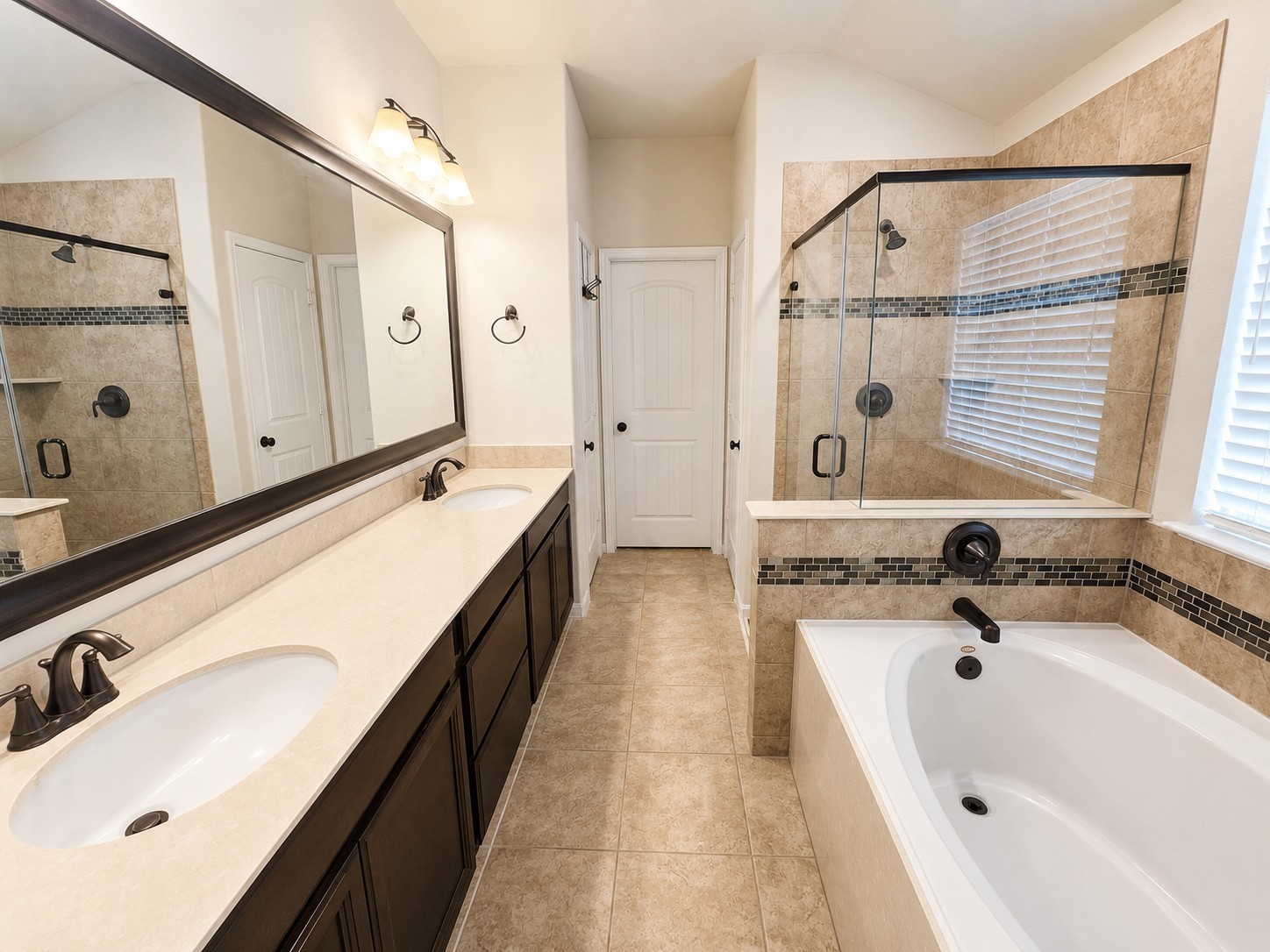 417 Kohls Crest Road La Porte, TX 77571 - Photo 12 of 22 Primary ensuite bath has double sink vanity, soaking tub, oversized shower and large walk-in closet