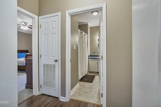 a view of a bathroom from a hallway