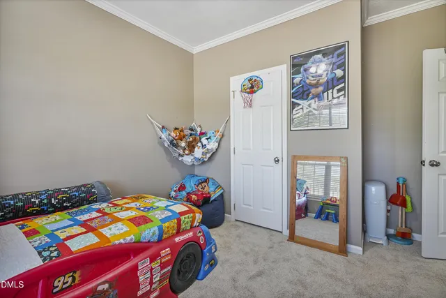 a bedroom with a bed and a baby