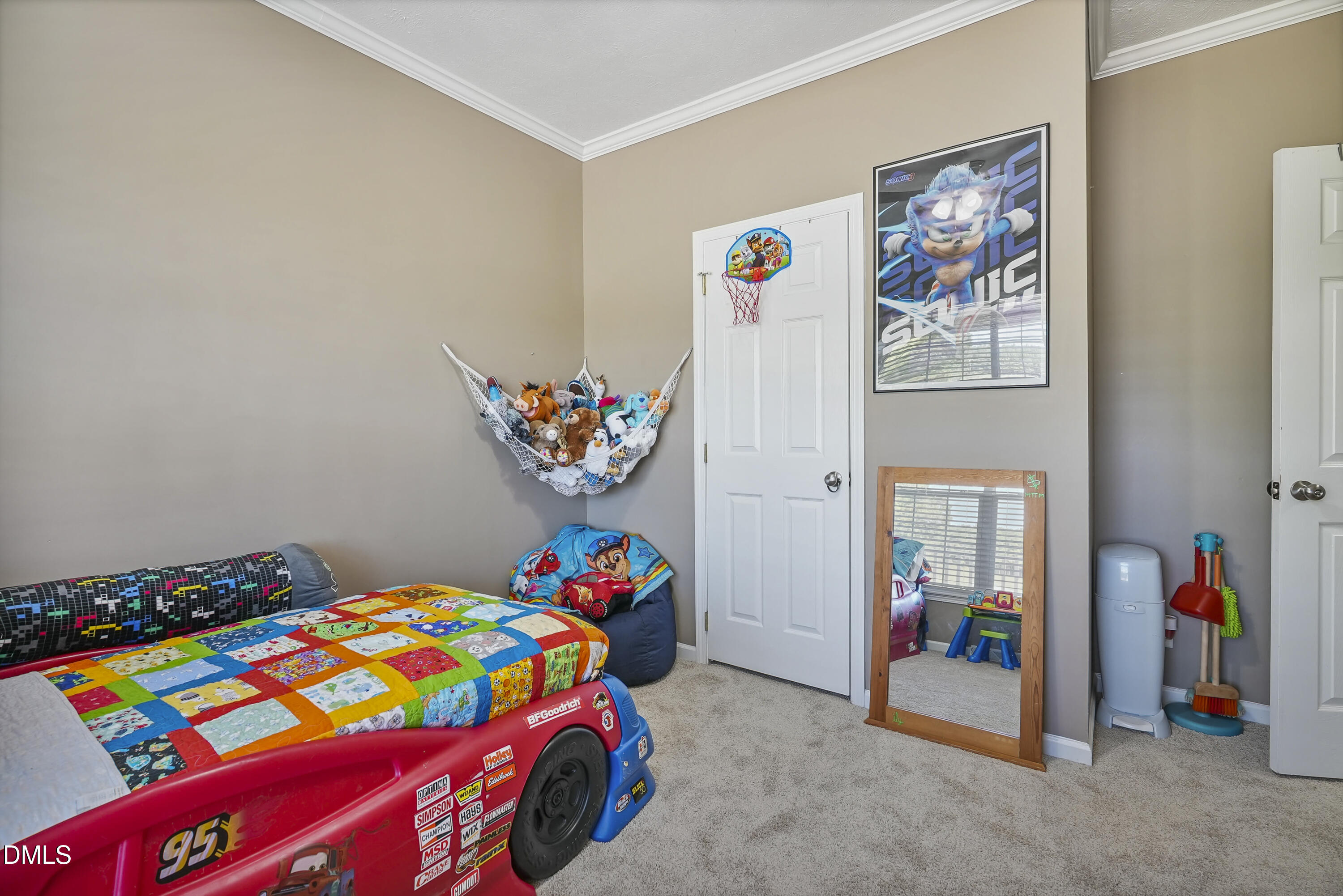 700 Mann Road Coats, NC 27521 - Photo 20 of 35 a bedroom with a bed and a baby