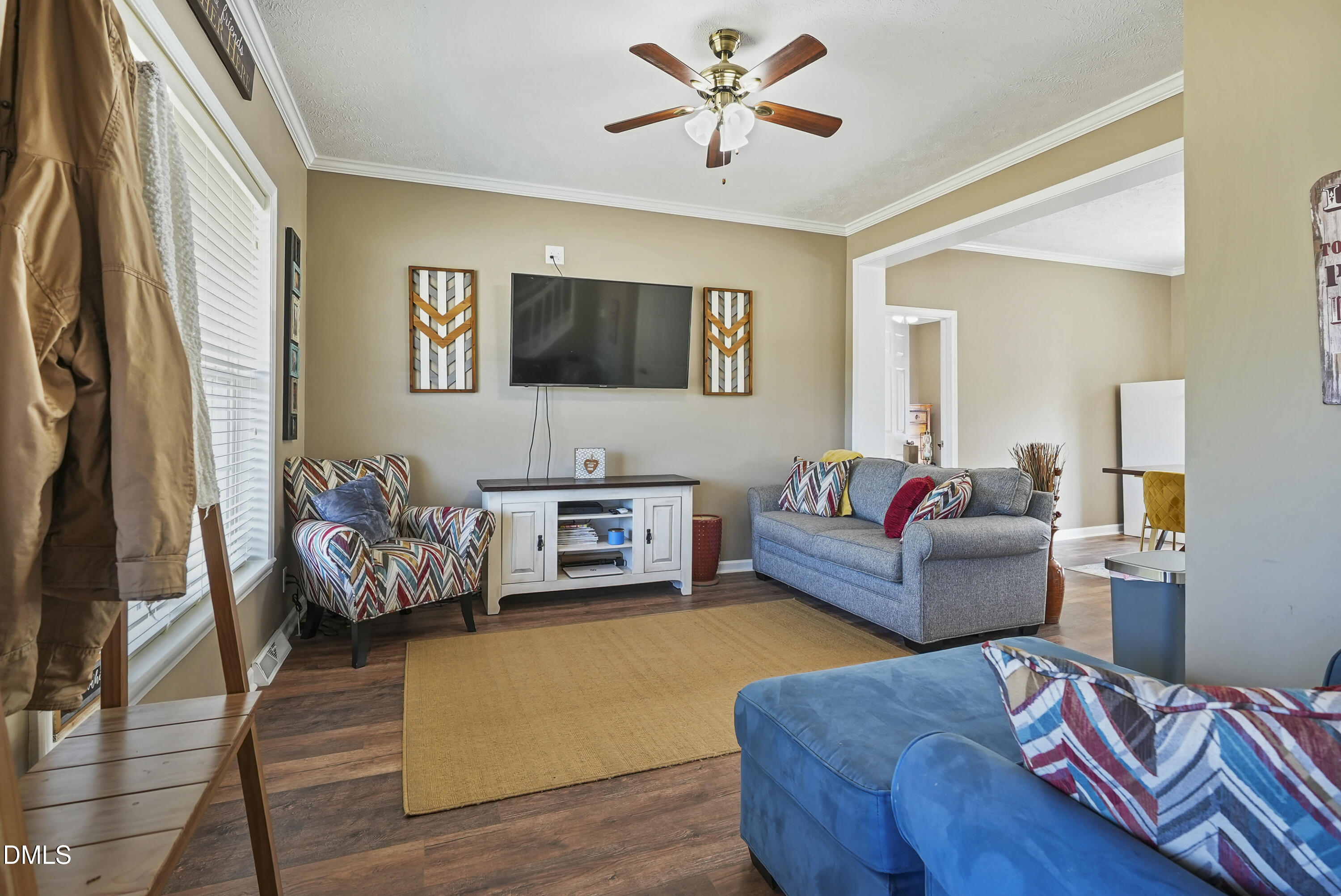 700 Mann Road Coats, NC 27521 - Photo 2 of 35 a living room with furniture and a flat screen tv