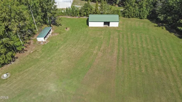 a view of a house with backyard porch and garden