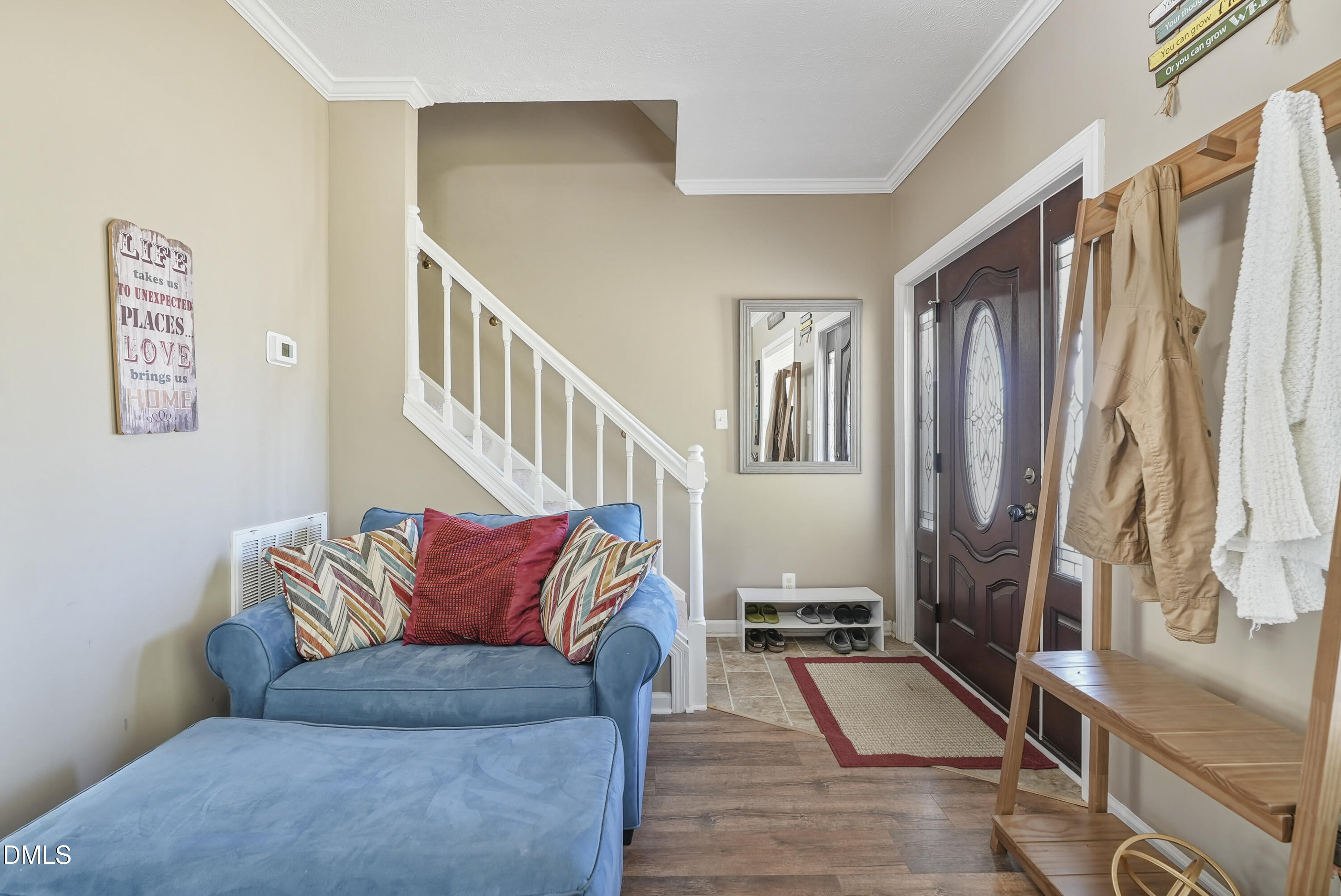 700 Mann Road Coats, NC 27521 - Photo 3 of 35 a living room with furniture fireplace and a large window
